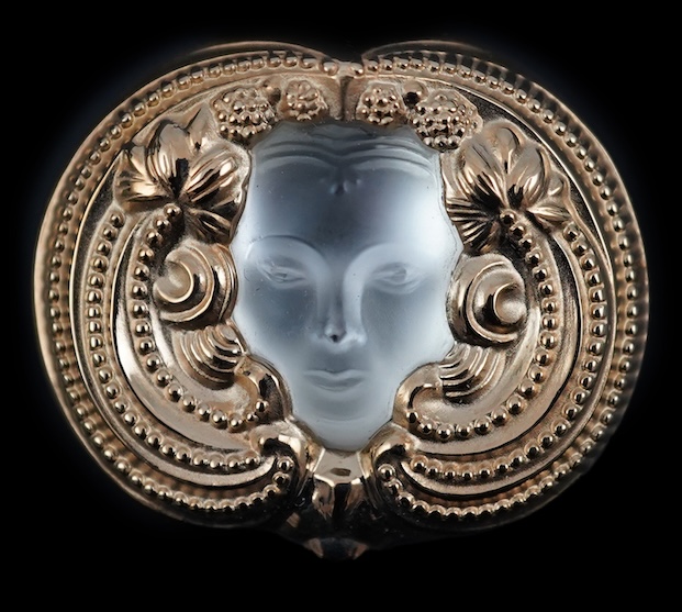 A Lalique mask brooch, cased